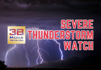 A dramatic lightning storm illuminates the night sky over a mountainous landscape. Bold red and white text reads "SEVERE THUNDERSTORM WATCH" on the right side. On the left side, the 3B Media News logo is displayed with the text "3B Media News.com" in red, blue, and black on a gold and silver gradient background.