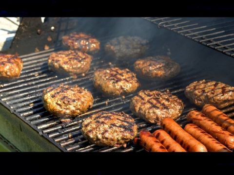 burgers and dogs on grill